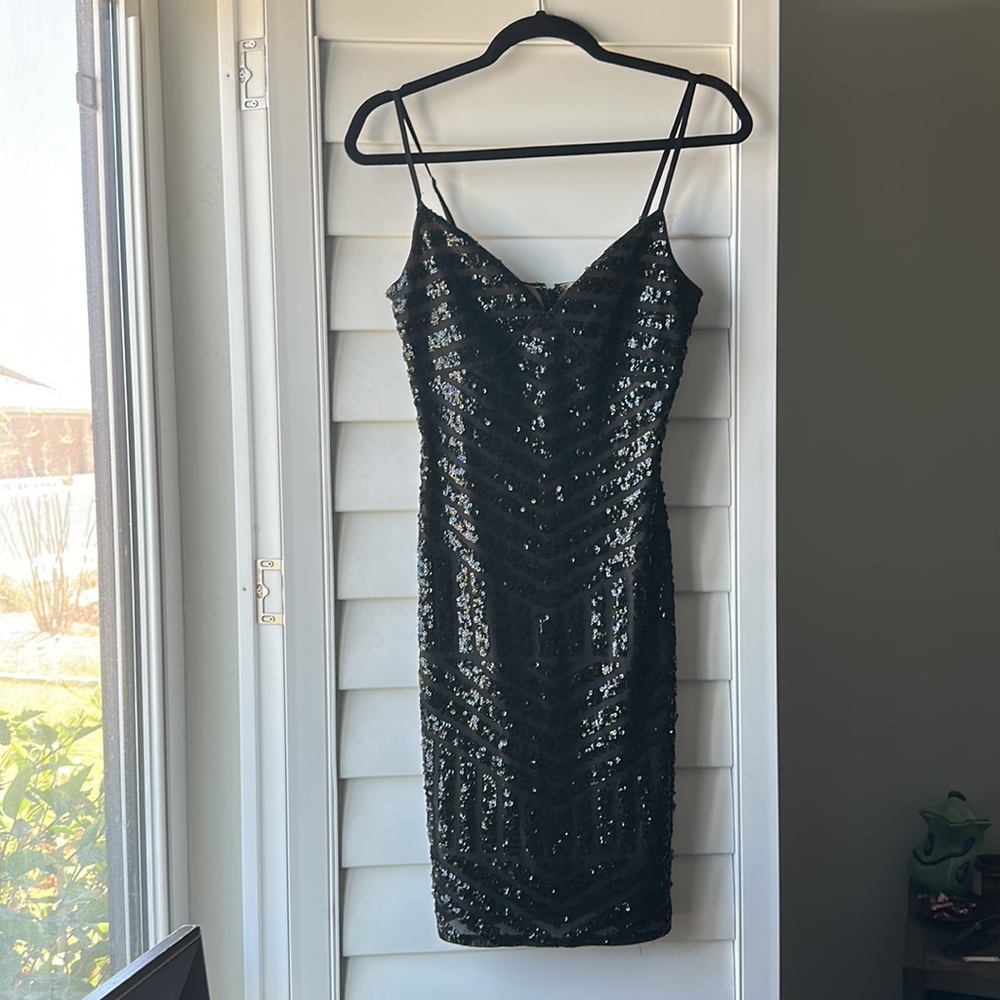 Mid length black sequined body con dress